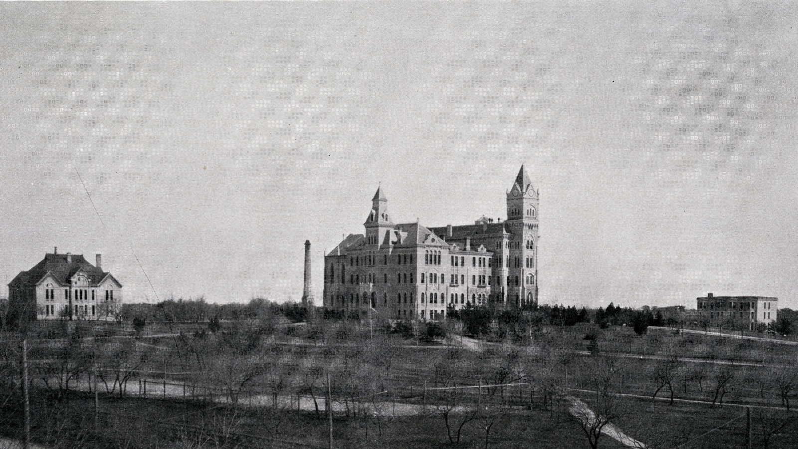 A historic old pic shows Old Main on The University of Texas at Austin campus is surrounded by only two small buildings and wide open spaces.